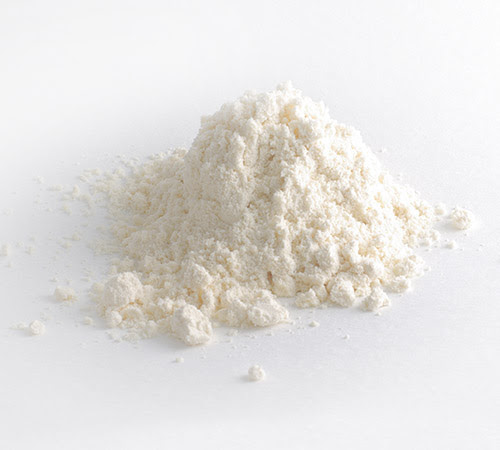 Handful of white powder on white